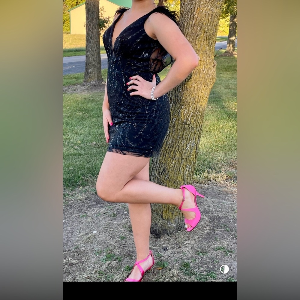 Women’s new years party black sequin dress with feather sleeves